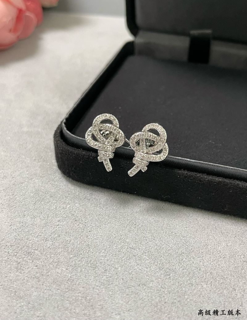 T*f*ny earrings